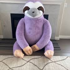 giant plush purple sloth in