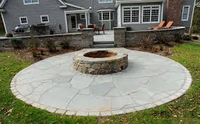outdoor stone patio with fire pit e a