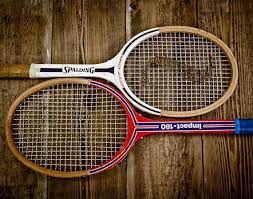 vintage tennis rackets on wood photo