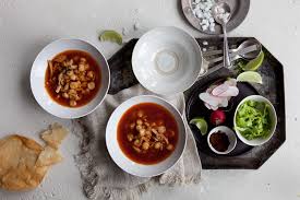 red pozole with traditional garnishes