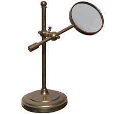 Magnifying Lens On Brass Stand At
