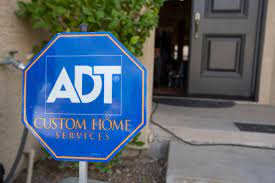a sign advertising adt custom home