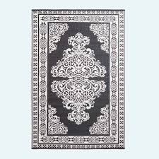 white motif design reversible outdoor rug