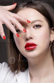 red y lips and nails close up