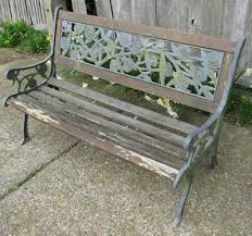 old wooden garden bench with cast iron