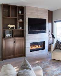 Gray Stone Fireplace With Inset Tv