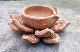 brown round clay diya pots