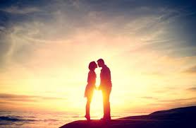 couple kissing at sunset on the beach