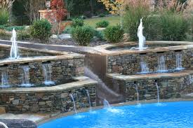 Find the best bubblers and inground pool fountains and waterfalls to transform your backyard into the ultimate outdoor sanctuary. Pool Waterfalls Huntsville Al Nashville Tn Burleson Pool Company