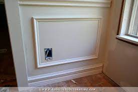 attach frame to wall with adhesive and