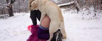 Horny blonde lady fucks a sexy dog in the snow