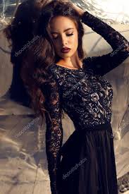 with dark hair in black lace dress