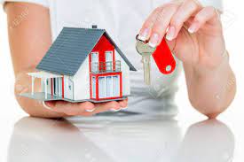 An Agent For Property With A House And A Key. Successful Leasing And  Property Sales By Real Estate Brokers. Stock Photo, Picture And Royalty  Free Image. Image 39799313.