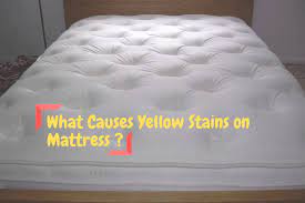 what causes yellow stains on mattress
