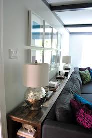 console table behind a couch