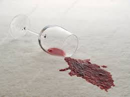 red wine spilled on white carpet