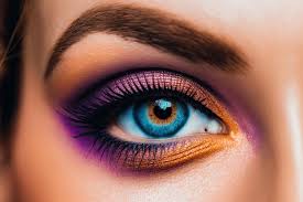 womans dramatic blue eye makeup with