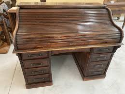 Rolltop desks are a classic pedestal desk design with a sliding tambour door and a series of drawers, shelves, and cubbies. Vintage American Roll Top Desk Feige Desk Company