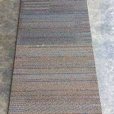 rustic looking carpet tile brown tan