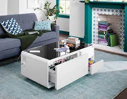 The magnussen t1124 darien wood lift top coffee table provides a tremendous amount of space, making picking up for unexpected company a matter of moments. This Smart Coffee Table That Went Viral On Tiktok Has A Fridge Drawer