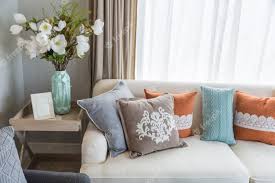 colorful pillows on beige sofa