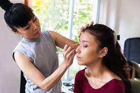 image of make up artist using pen eyeliner