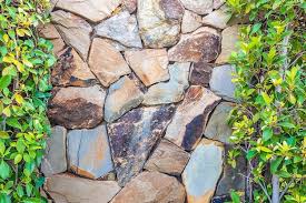 Brown Gray Stone Wall With Green Leaves