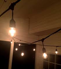 The Easiest Way To Hang String Lights On A Screened Porch
