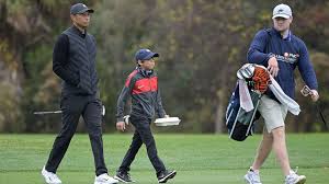 Charlie woods won a junior golf tournament in florida last weekend, people reports, and the elder woods was right beside him, carrying his clubs—an image that went viral on social media. When It S Tiger Woods The Son Becomes More Famous Than Dad Abc News
