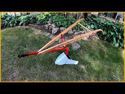 old antique hand plow red