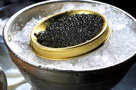 Salmon roe (left) and sturgeon caviar (right) served with mother of pearl caviar spoons to avoid tainting the taste of the caviar. Pure Beluga Caviar Banned In Us For Sale In South Florida South Florida Sun Sentinel