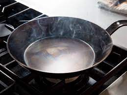how to season carbon steel pans