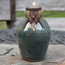 green ceramic outdoor tiki torch with