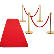 gold stanchions with red carpet for