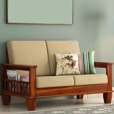 Fabric sofas, two couches in the same style, made with the same quality frame, will always cost more in leather but is likely to last longer. Pooja Wood Decor Sheesham Wood 2 Seater Sofa Set With Fabric Cushion For Living Room Home And Office Furniture Wooden Sofa Set Honey Finish Amazon In Home Kitchen