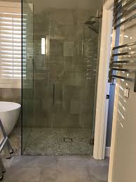 curbless shower with frameless glass