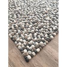 round rectangle stone felt ball rug