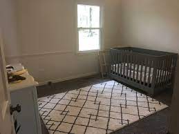 furniture and rug placement in nursery