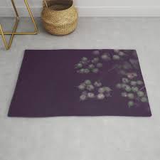 sage green seeds on deep plum rug by