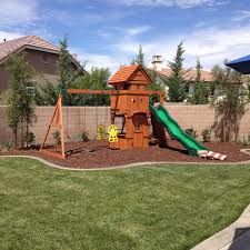 Backyard discovery is the largest residential wooden swing sets manufacturer in the us. Landscaping Underneath Swing Sets Backyard Swing Sets Playground Landscaping Backyard Playground Sets