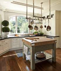 Kitchen islands with butcher block tops, for example, not only provide a strong, sturdy surface for cutting and chopping on and a smooth and steady millions of homeowners use butcher block tables made by john boos & co. 40 Kitchens With Hanging Pot Racks Pictures Kitchen Design Small Square Kitchen Kitchen Design
