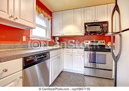 Price and stock could change after publish date, and we may make money from these links. Cozy Kitchen Room With Red Wall And White Cabinets Small Kitchen Room With Concrete Tile Floor Red Walls Steel Appliances Canstock
