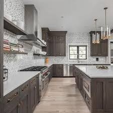 Best wood stain brand for kitchen cabinets. White And Gray Marble Herringbone Tiles With Dark Brown Cabinets Brown Kitchen Cabinets Kitchen Cabinet Color Schemes Dark Brown Cabinets