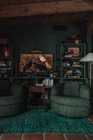 a monochromatic dark green bedroom