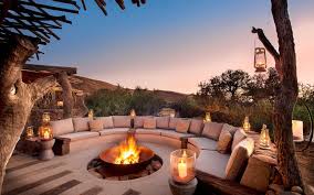 The patio area located at ground level of this home has everything you could ever need for comfort. Top 10 Safari Lodges In Africa Outdoor Fireplace Designs Backyard Patio Designs Backyard