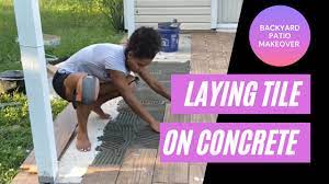 laying ceramic tile on a concrete patio