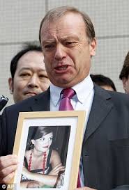 Grief: Bill Hawker breaks down as he holds a picture of his murdered daughter outside court. He thanked the Japanese for persisting in hunting down ... - article-2013013-0D19493C00000578-591_306x451