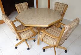 It comprises a solid wooden oval table. Classic Wood Caster Chairs Dinette Set With Octagon Wood Table Usa Dinettes