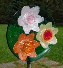 Trio Of Glass Flowers On A Green