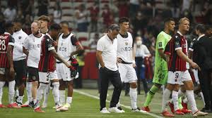 The ligue 1 game at nice was halted when a fight broke out after fans threw a bottle at marseille players, who then threw the object back . Ew82mrfknu2hum